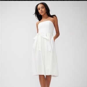 Fit and flare strapless eye lit dress .